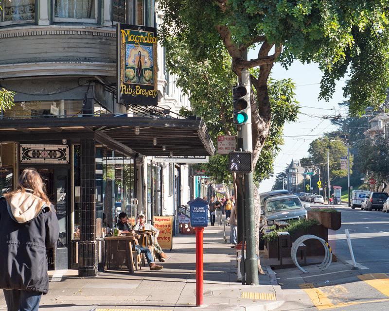 A pedestrian on Haight Street at Masonic Avenue