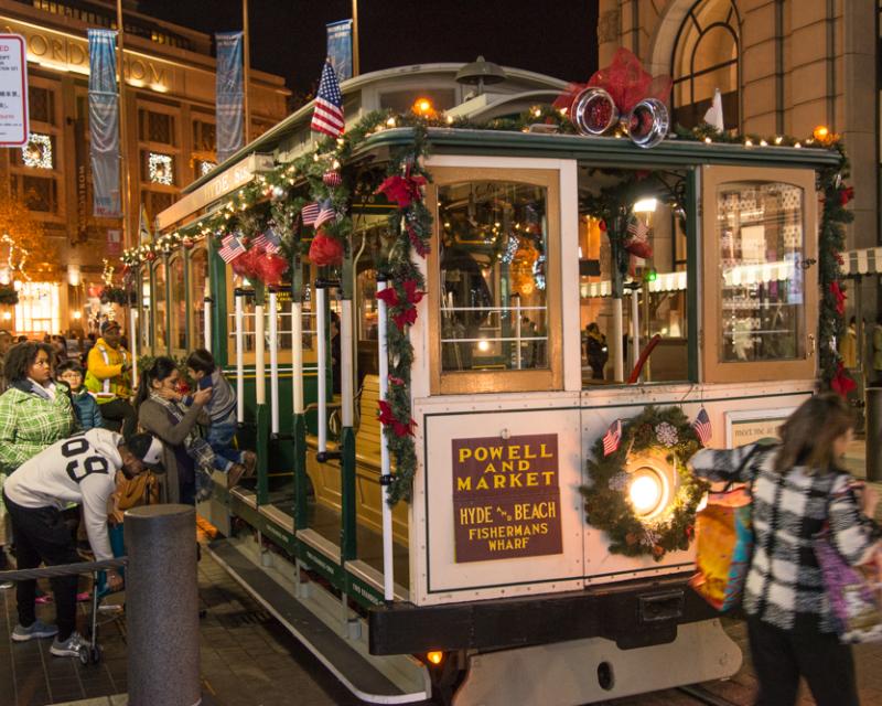 decorated cable car and passengers