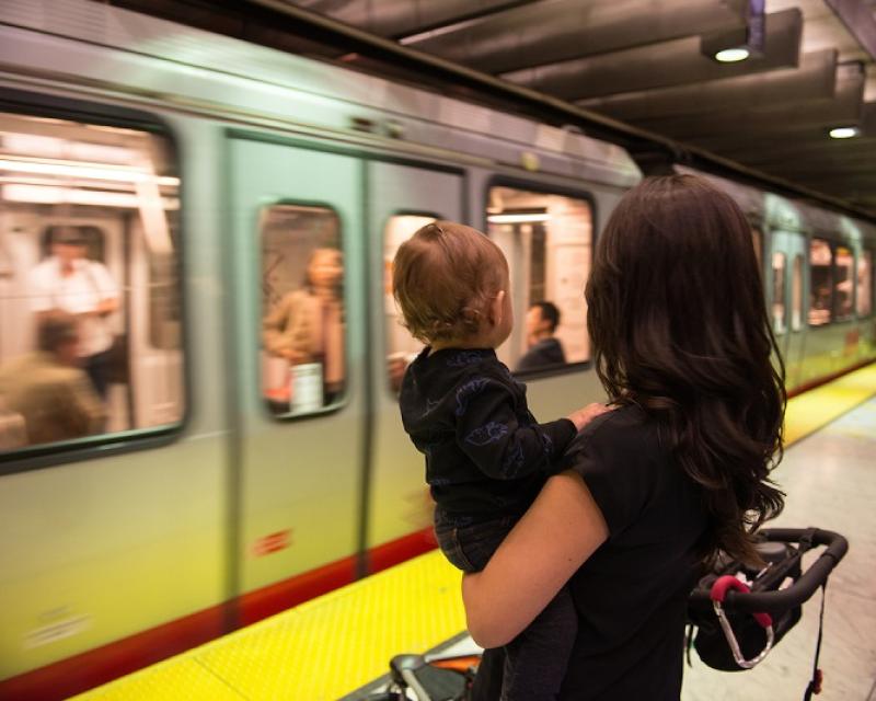 Mom and baby waiting for the train.
