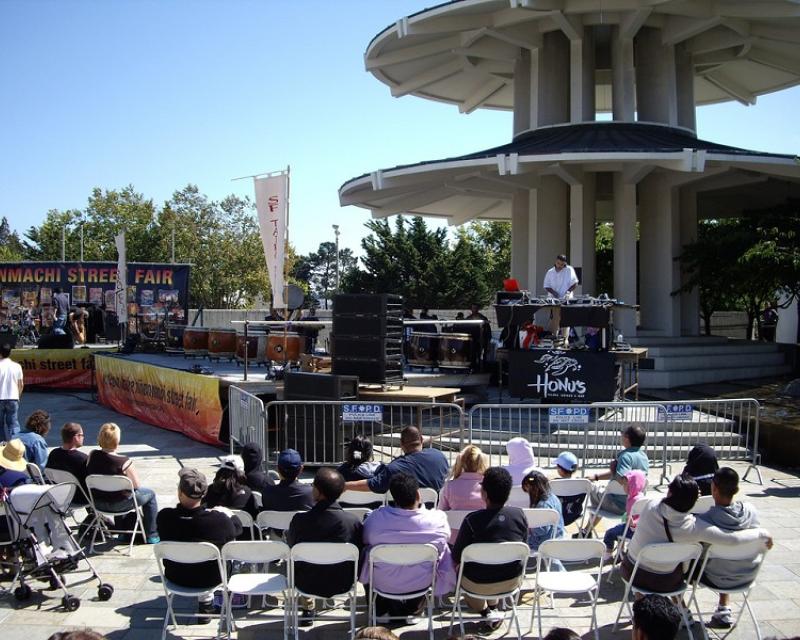 People in Japantown listening to music