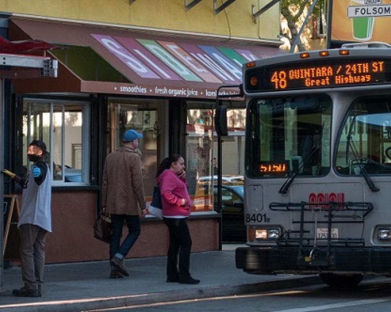 A 48 Quintara coach picking up people.