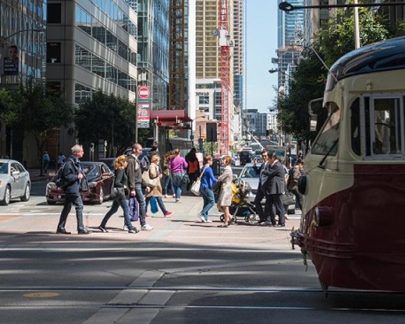 People crossing the street downtown.