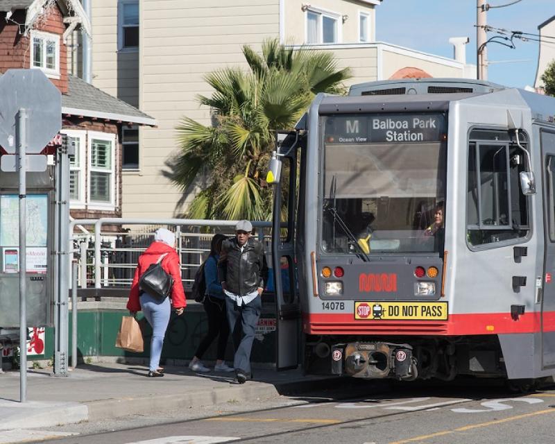 Customers boarding an M Line train