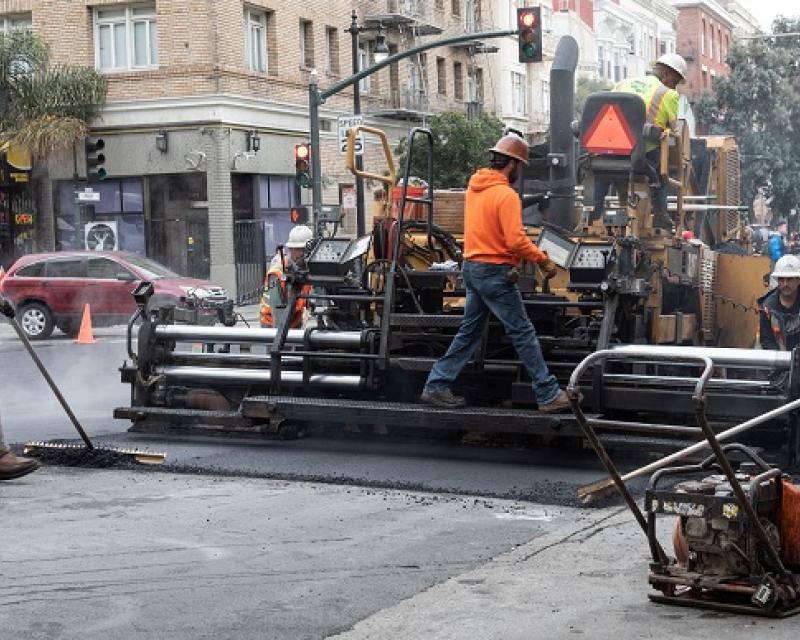 Men working on Polk Street.