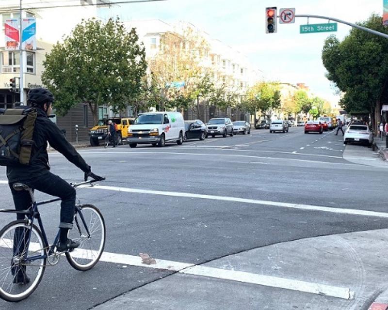 People biking along Valencia.