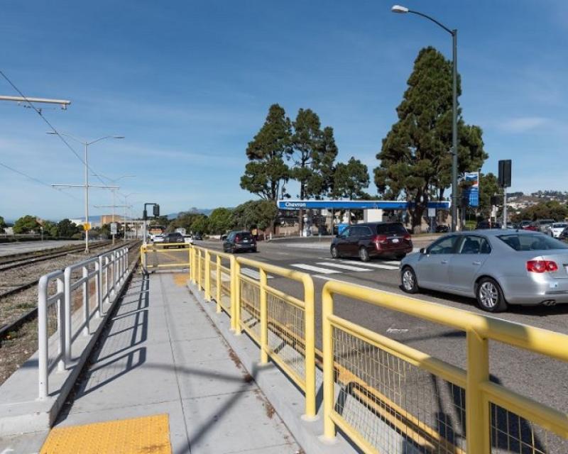 New pedestrian refuge for people walking across 19th Avenue.