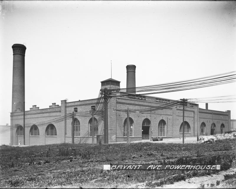 brick building with smokestacks and arched windows