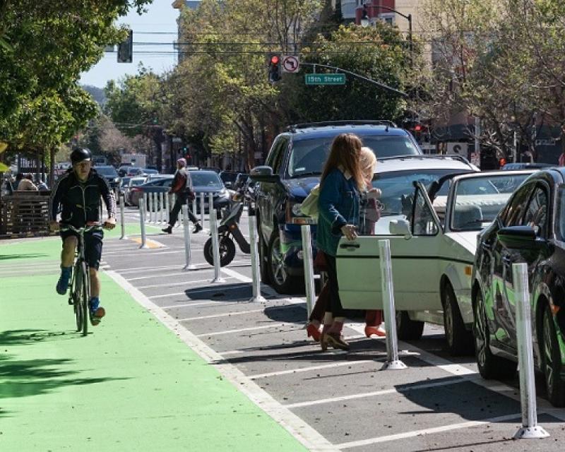 Man biking on the Valencia Street bike path