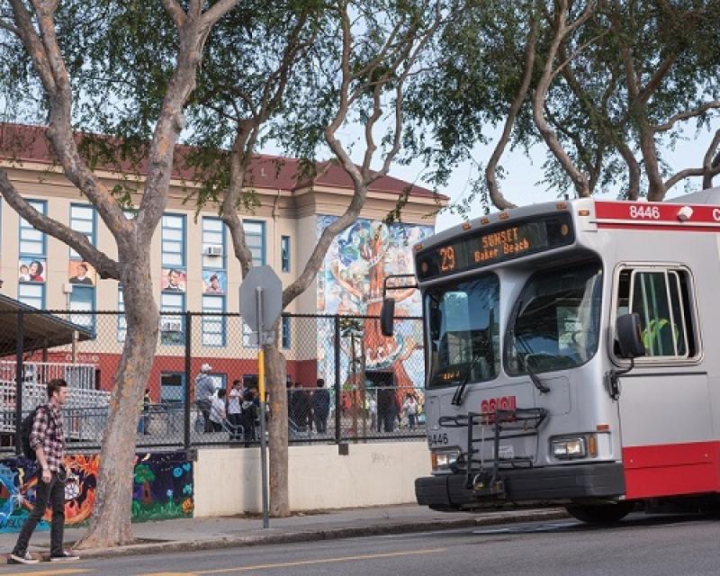 People boarding a coach in the Excelsior 