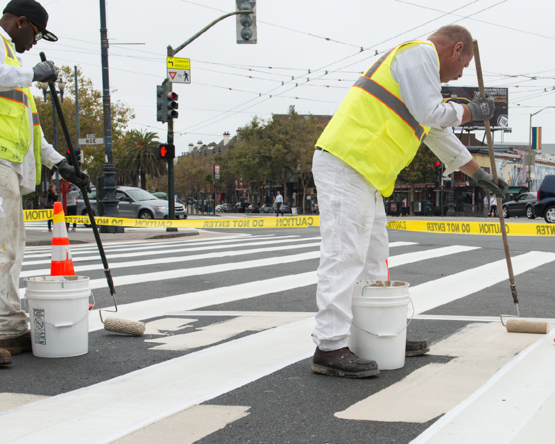 staff painting a new painted safety zone