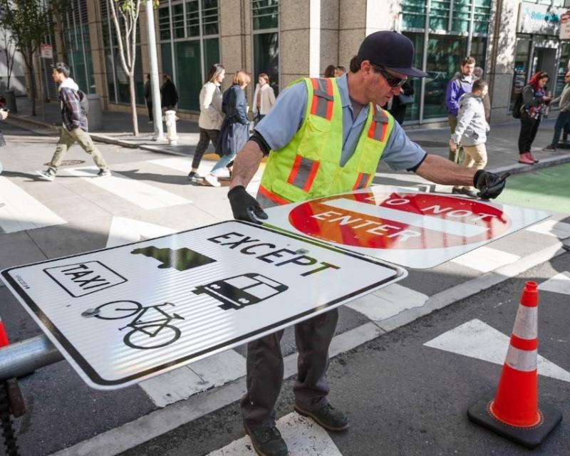 Crews installed signs along side streets in preparation for the changes on January 29.