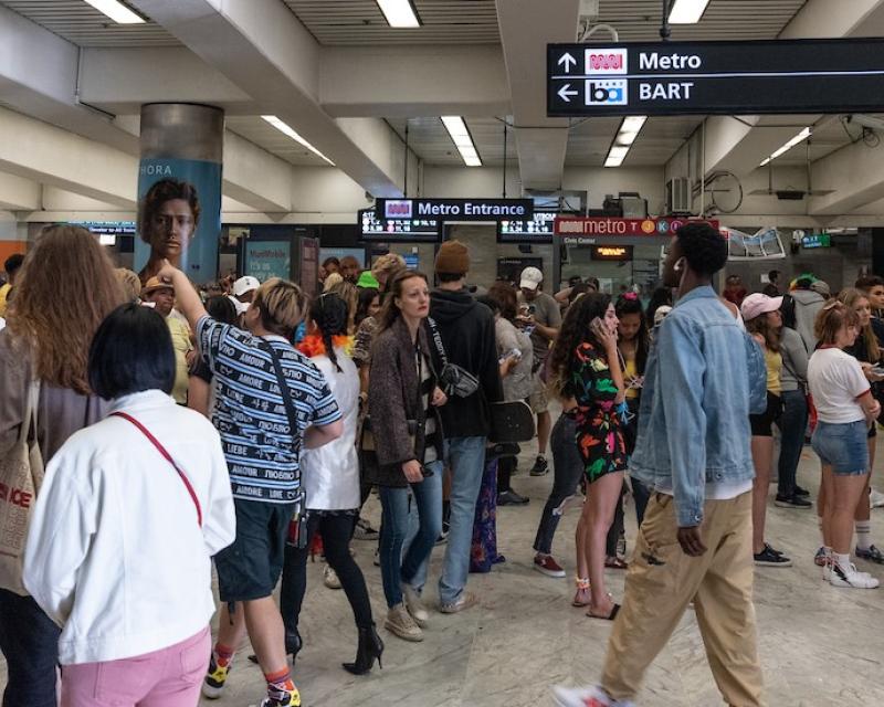people heading into the subway at Civic Center Station