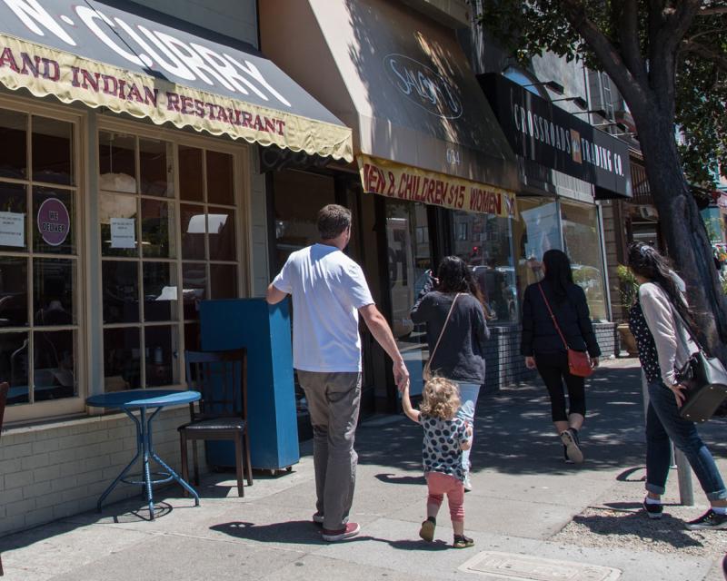 Image of store patrons in front of small businesses 