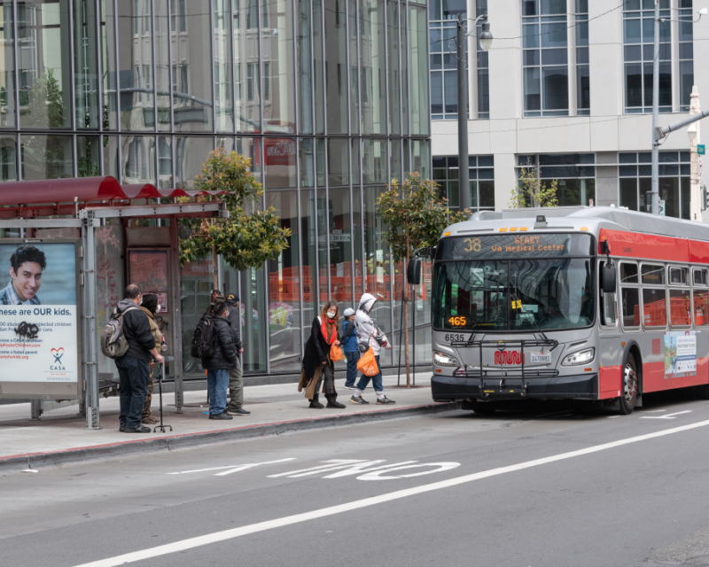 Passengers board 38 Geary on Geary at Van Ness