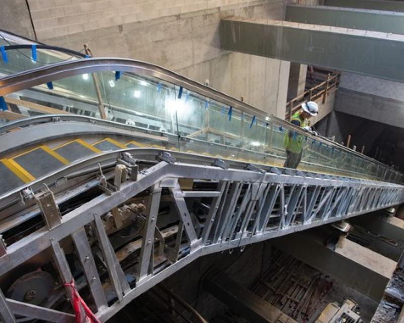 Working on escalator in Rose Pak Chinatown Station
