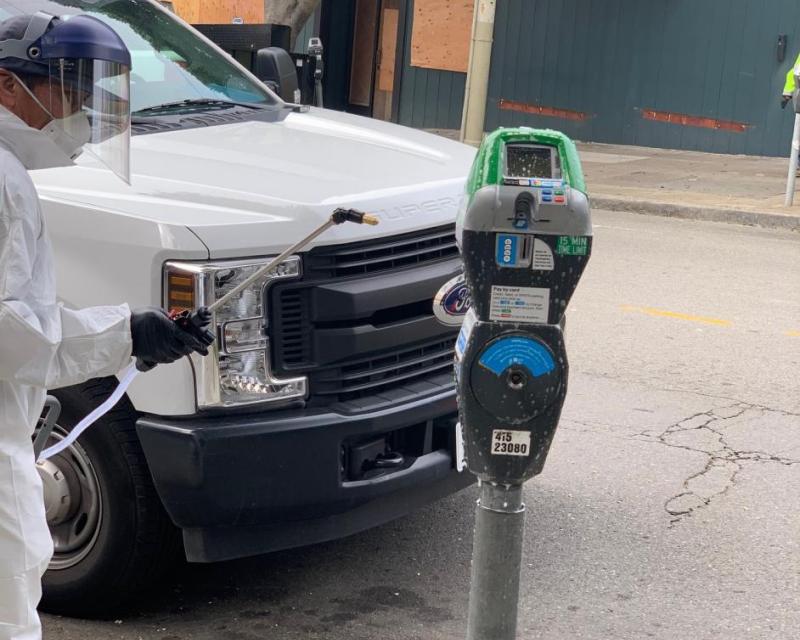 Parking Meter Being Cleaned