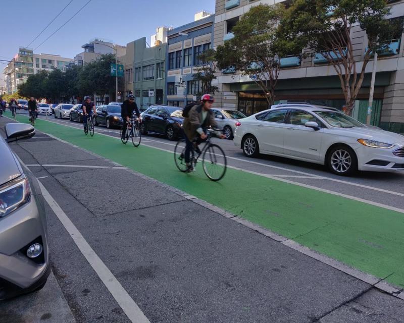 Bikers using the bike lanes on Folsom Street