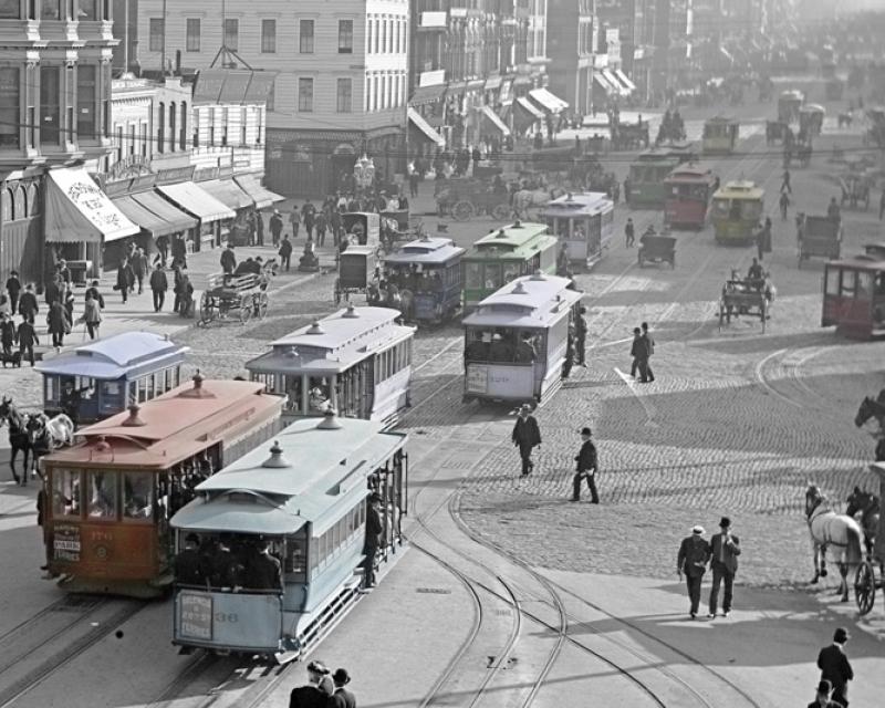 colorized photo of cable cars on market street at ferry building