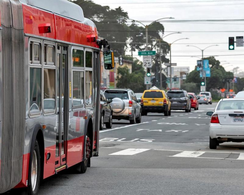 Photo of bus in the 38 Geary temporary emergency transit lane with auto traffic in the adjoining lane