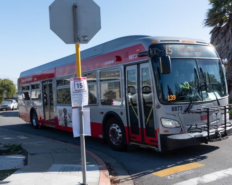Image of 15 Express bus with temporary signage indicating new stop