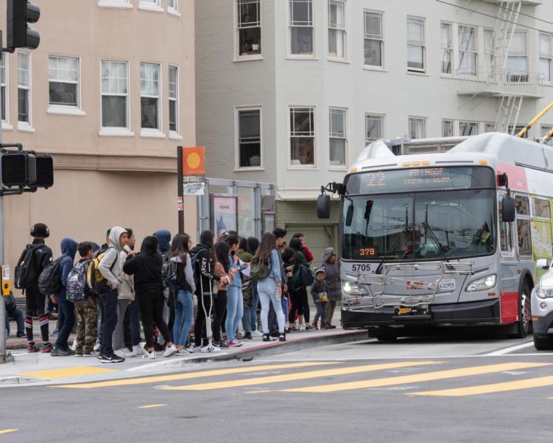 Students board a Muni bus