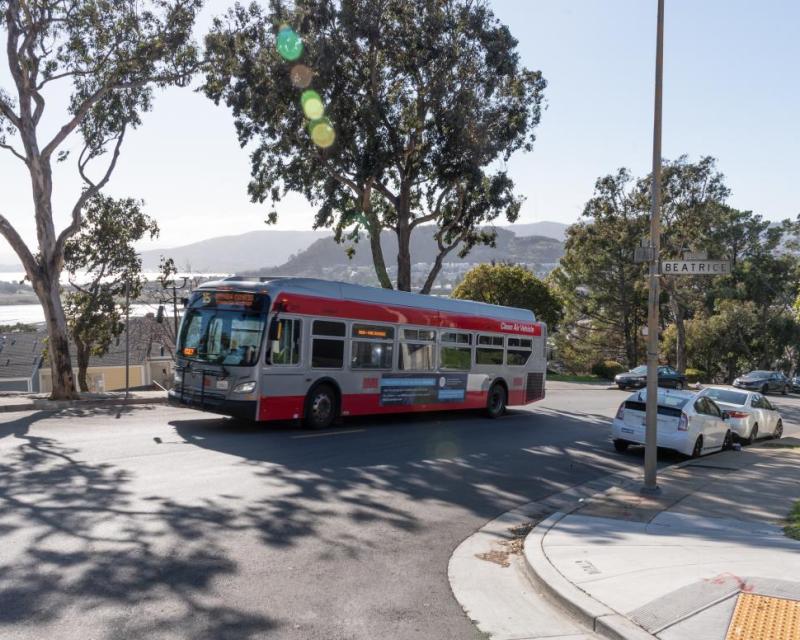 15 Bayview Hunters Point bus traveling on a street in Bayview