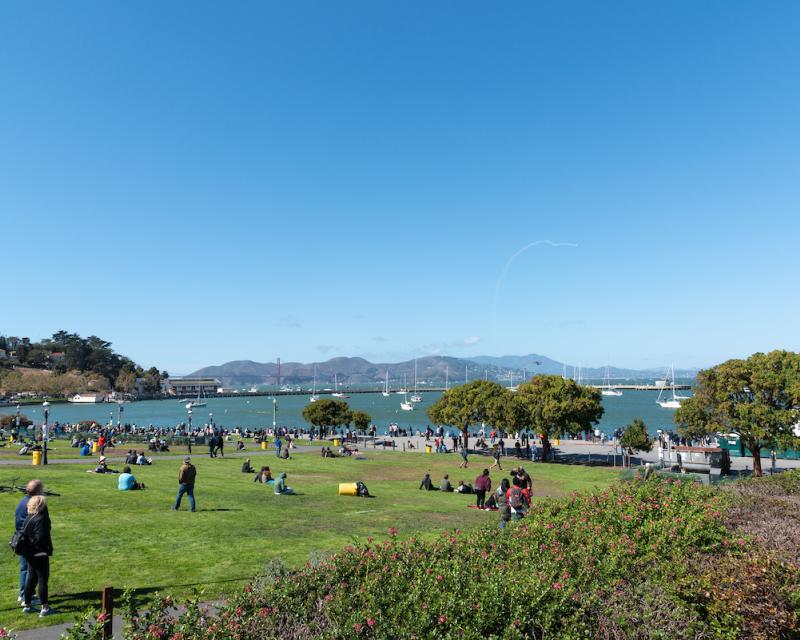 People enjoying views of Aquatic Park on a sunny day