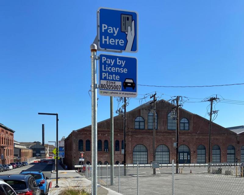 Pay Here and Pay by License Plate parking meter signs