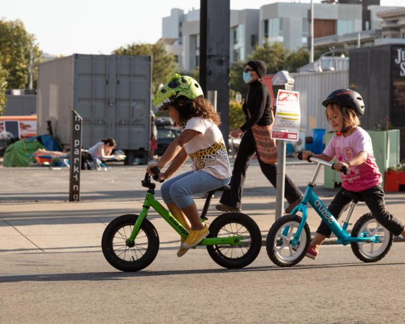 Children biking on a Slow Street