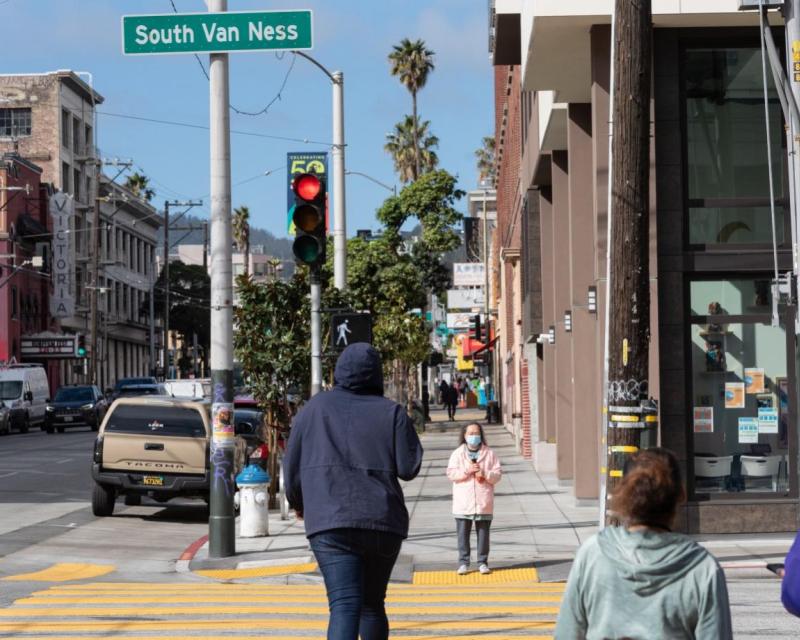 View of pedestrians crossing South Van Ness Avenue post project implementation.