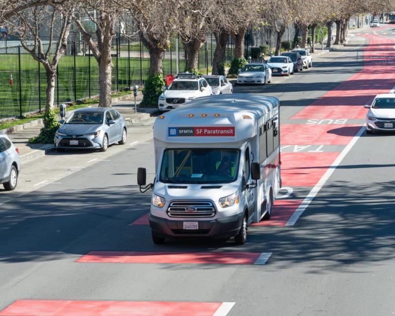 SFMTA Paratransit bus traveling in a transit lane. 