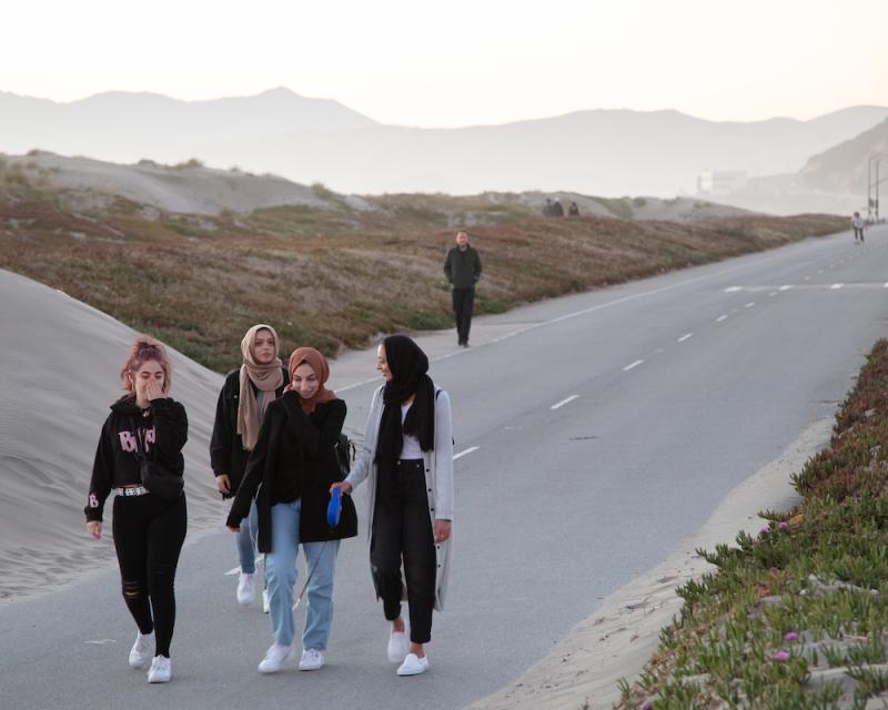 Pedestrians walking along Great Highway