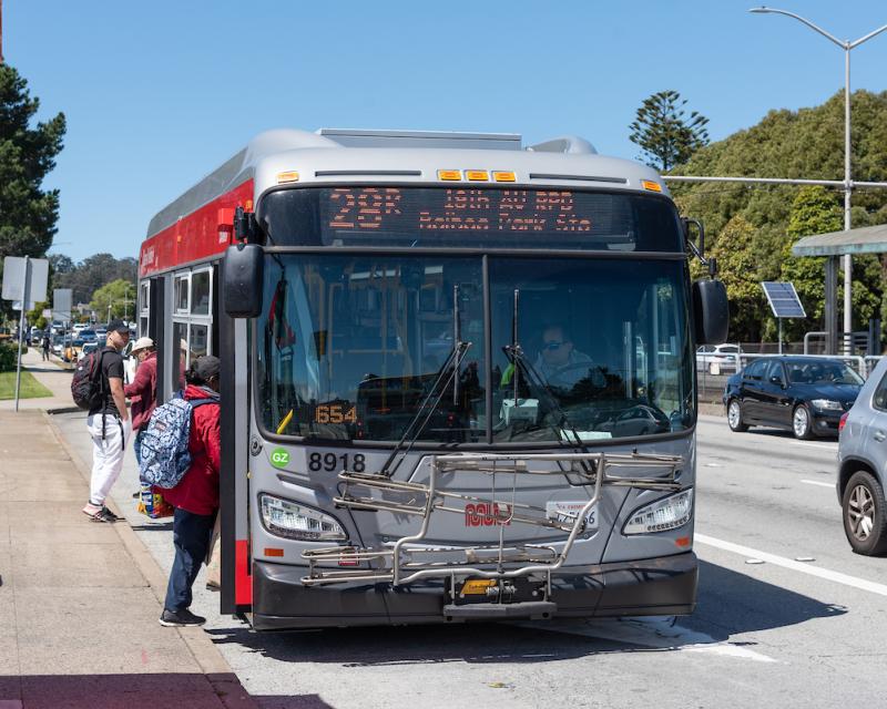 People boarding the 28R bus on 19th Avenue.