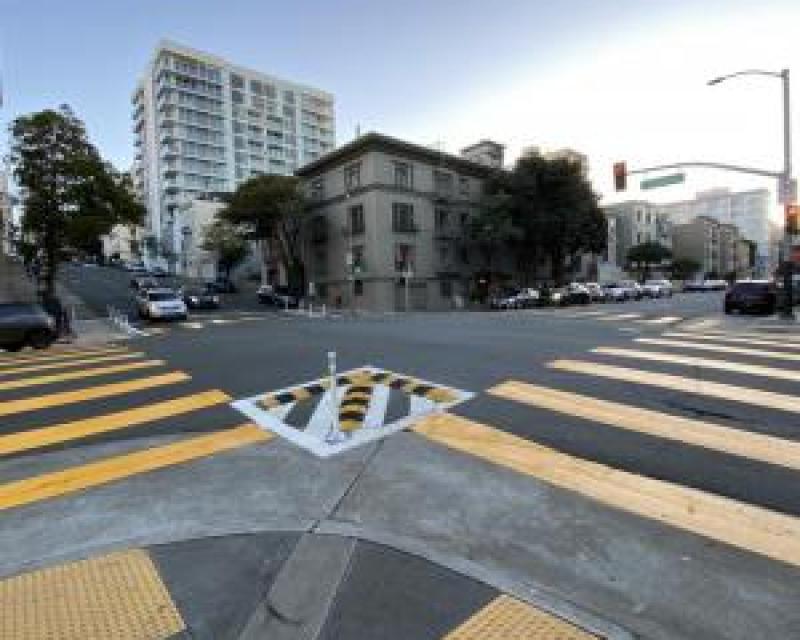 yellow crosswalks and raised mountable curbs on the corner at franklin street 