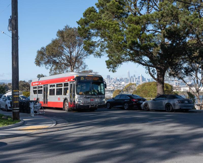 Muni line 15 with the San Francisco skyline in the background