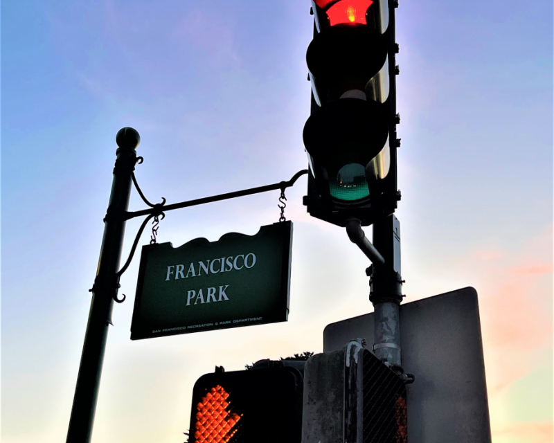 Traffic signals in front of Francisco Park