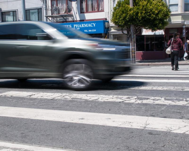Car speeding through an intersection in San Francisco.