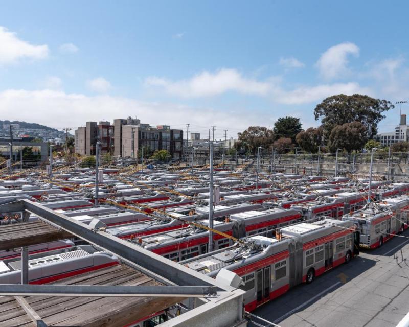 elevated view of a crowded bus yard