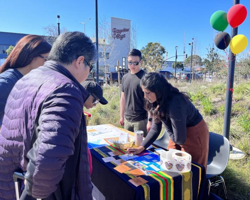 SFMTA staff talk to community members at the Southeast Community Center