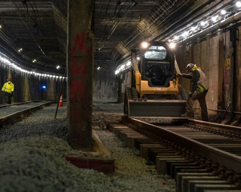 Image of workers and machinery inside of the Twin Peaks Tunnel