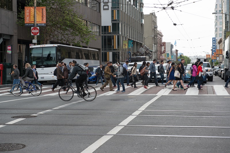 Commuter shuttle travelling on downtown city streets