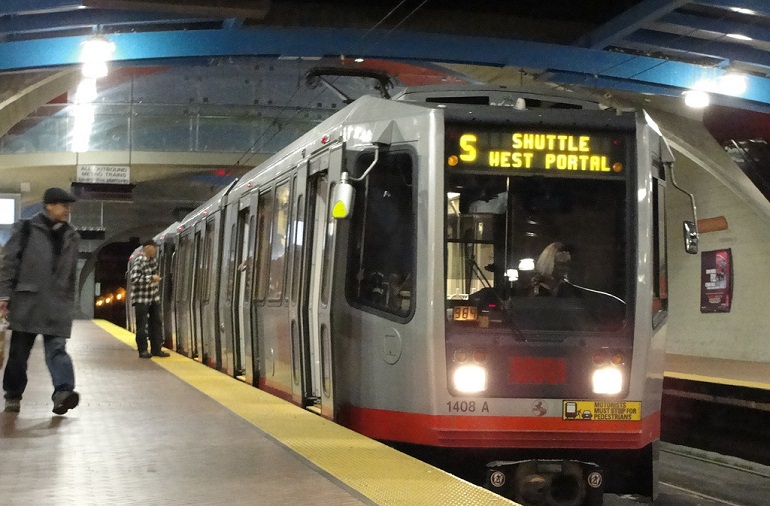 A Muni Metro train at West Portal station with a headsign that reads, "S Shuttle West Portal."