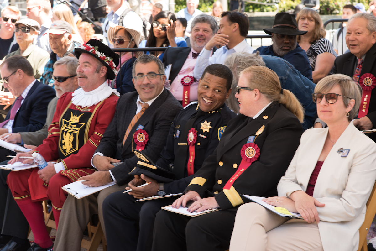 Cable Car Bell Ringing judges sitting under an event tent in Union Square