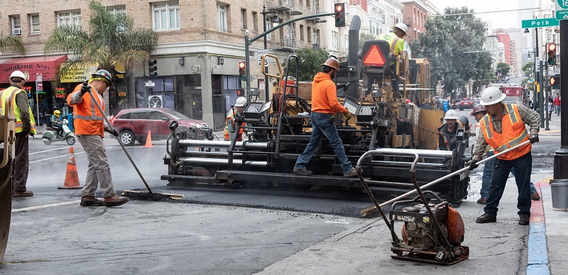 Men working on Polk Street.