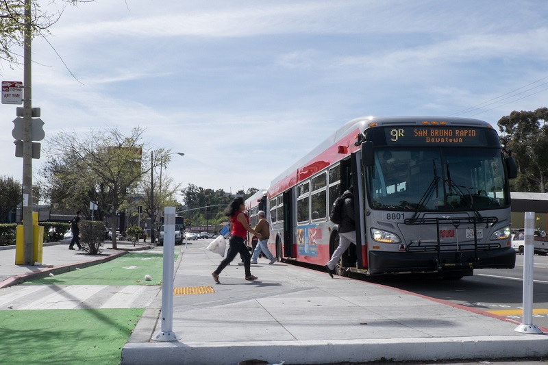 A 9R Bayshore coach picking up people.