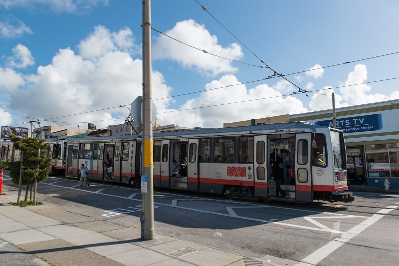 People alighting L Taraval train using "clear zones" that improve safety.