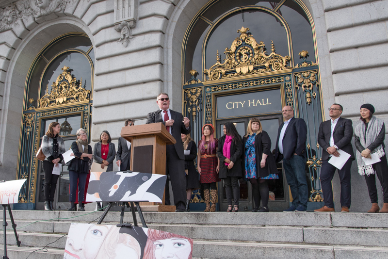 John Haley speaking at press conference