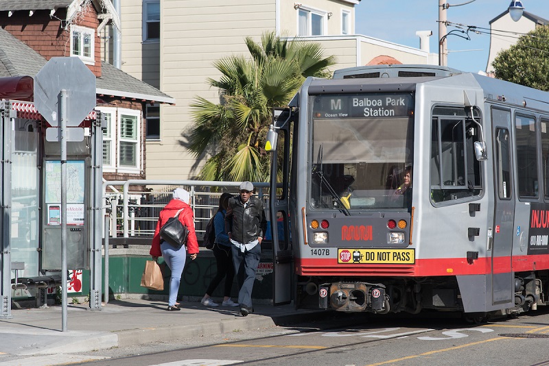 Customers boarding a M Line train