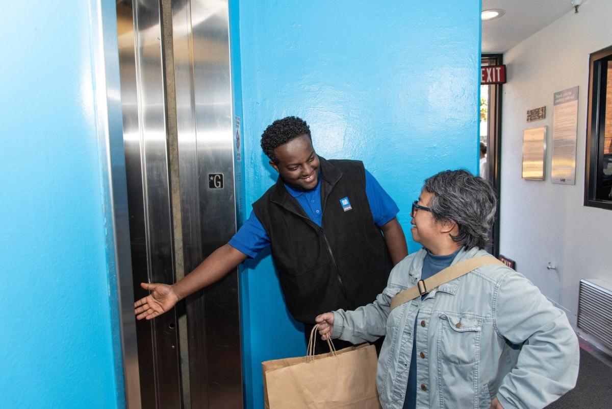 City-Owned Parking Garage Ambassador Assisting Customer