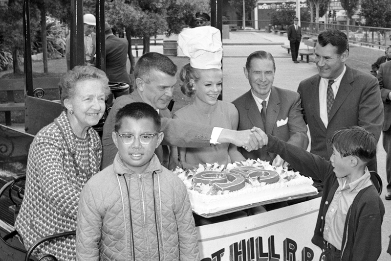 group of peole with large cake